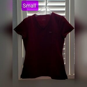 Jaanuu scrub Top 1 Pocket. Small/Regular.Color. Wine